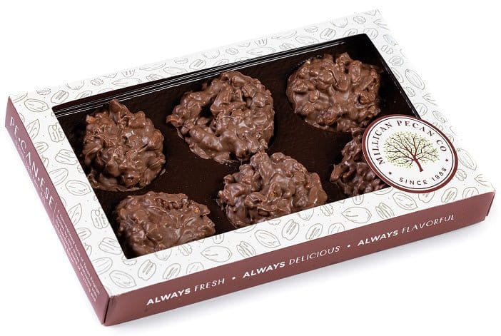 Millican Pecan milk chocolate pecan clusters in an 8oz gift box, featuring crunchy pecans coated in smooth milk chocolate.