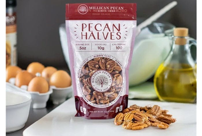 Millican Pecan fresh shelled raw pecan halves showing golden-brown nuts in a bowl, ideal for baking or snacking.