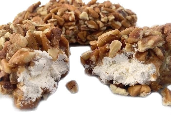 Millican Pecan Log Rolls, pecan treats with rolled pastry and pecan filling, displayed on a plate
