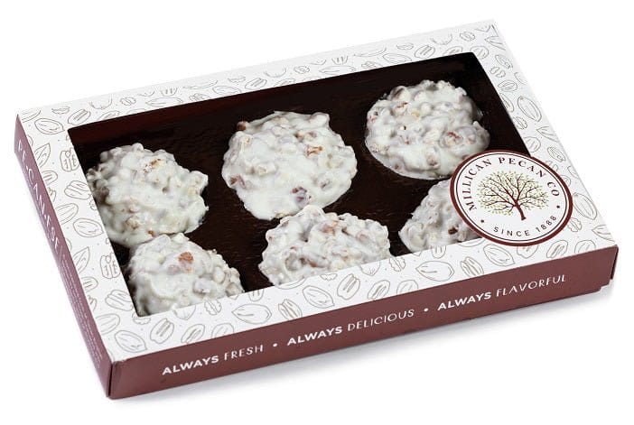 White chocolate pecan clusters in a gift box by Millican Pecan, featuring crunchy pecans coated in creamy white chocolate.