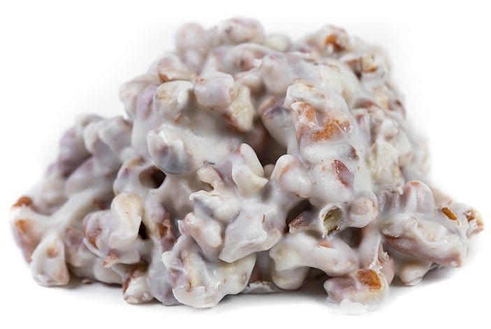 Millican Pecan white chocolate pecan cluster, individual pecan treat with white chocolate coating and crunchy pecans.