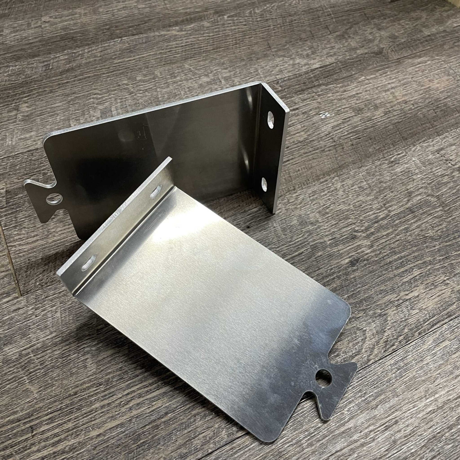 Bootstrap Farmer mounting cleats for securing equipment, shown in a close-up image with metal brackets and mounting hardware.