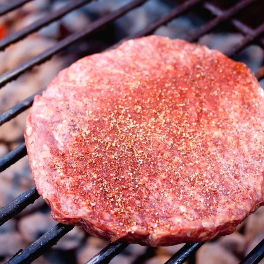 Four pre-formed Nebraska Bison burger patties in a case, each weighing 1/3 pound, for making Bison burgers.