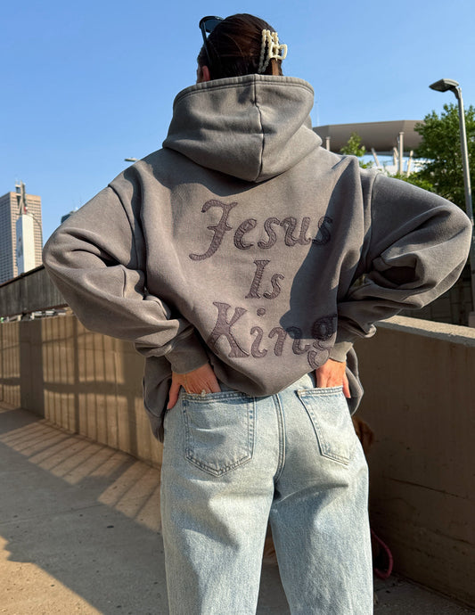 Unisex hoodie from Elevated Faith with "Not Sorry Jesus Is King" printed design, soft fabric, casual style, and comfortable fit.