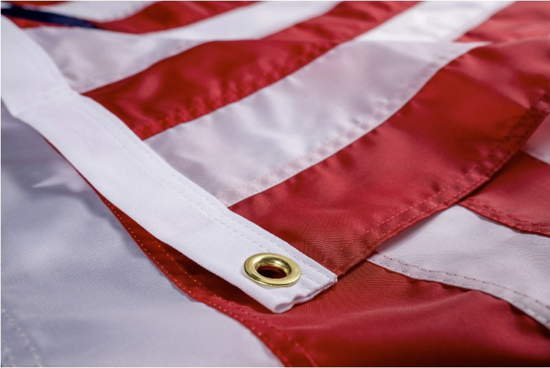 Liberty™ nylon American flag by Flagman of America featuring red, white, and blue stripes with stars, displayed outdoors.