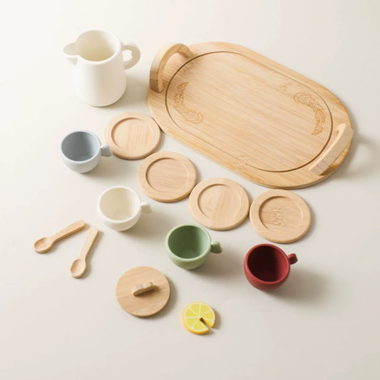 Toy tea party set by Petite Pioneers featuring colorful cups, teapot, and plates for imaginative play.