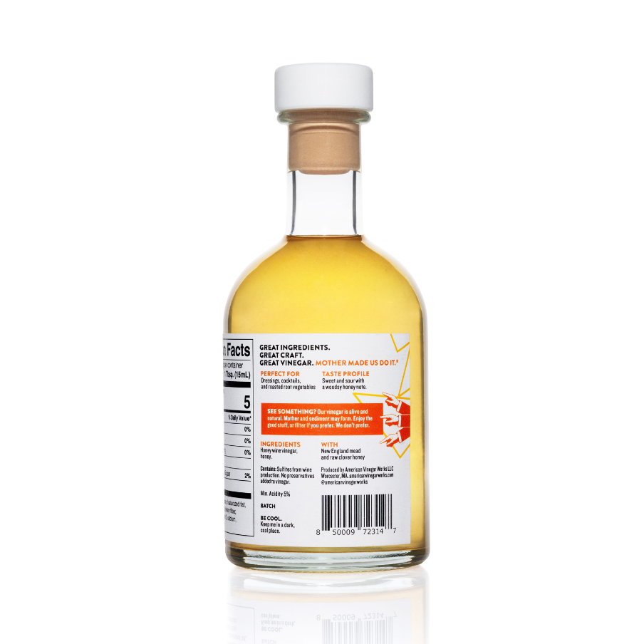 Bottle of American Vinegar Works Original Honey Wine Vinegar with a clear label, showing the amber-colored vinegar inside.