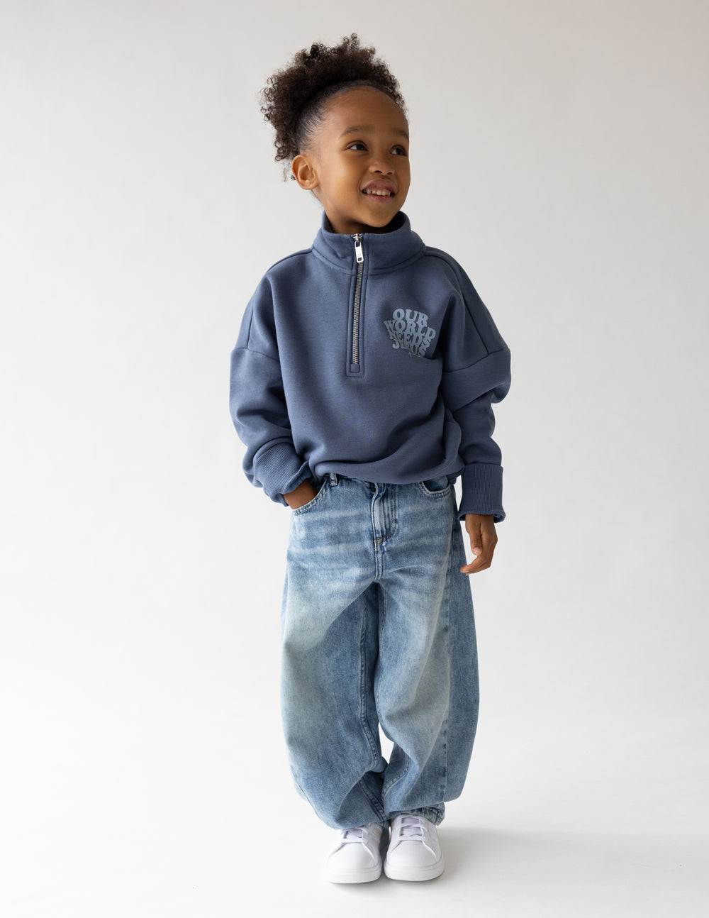 Kids jacket by Elevated Faith featuring "Our World Needs Jesus" half-zip design, suitable for children, casual wear.