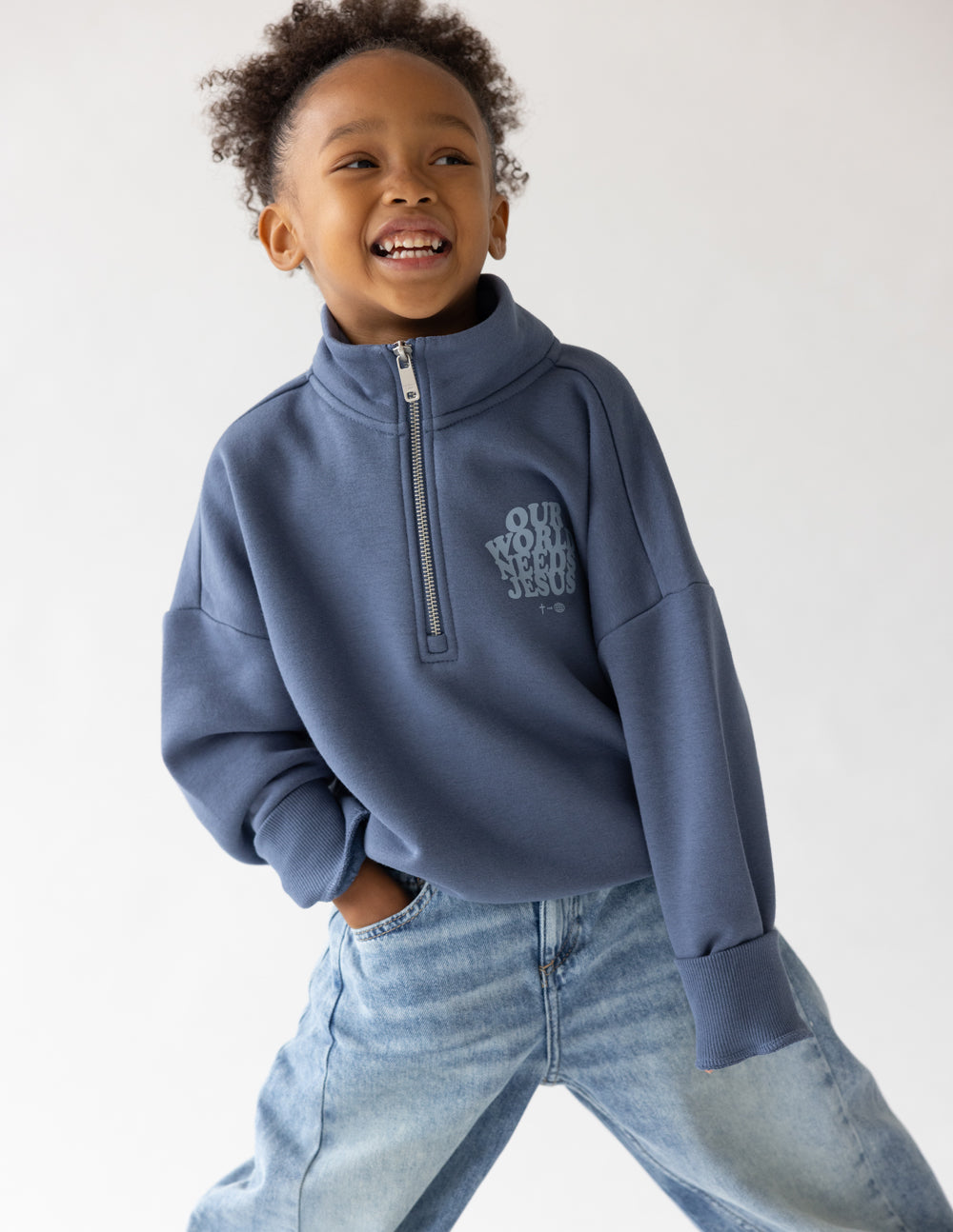 Kids jacket by Elevated Faith featuring a half-zip design with "Our World Needs Jesus" print, suitable for children.