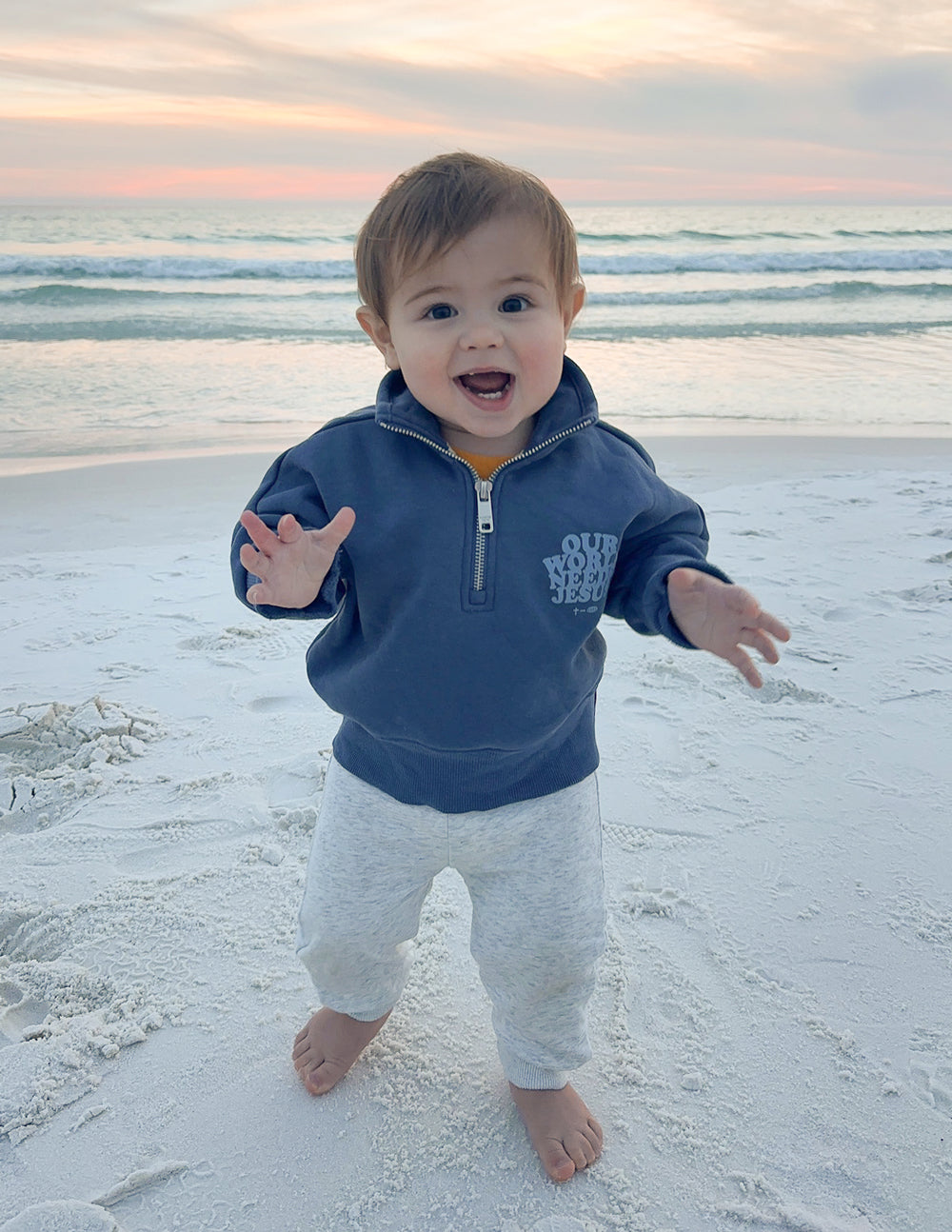 Kids jacket by Elevated Faith, Our World Needs Jesus Half-Zip in vibrant colors, featuring a motivational design for children.