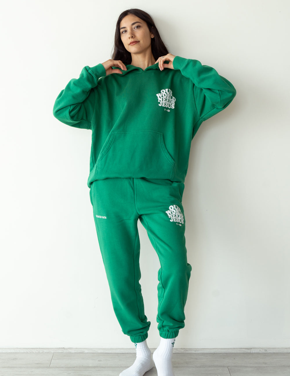 Unisex sweatpant featuring "Our World Needs Jesus" text from Elevated Faith, casual comfortable clothing for men and women.