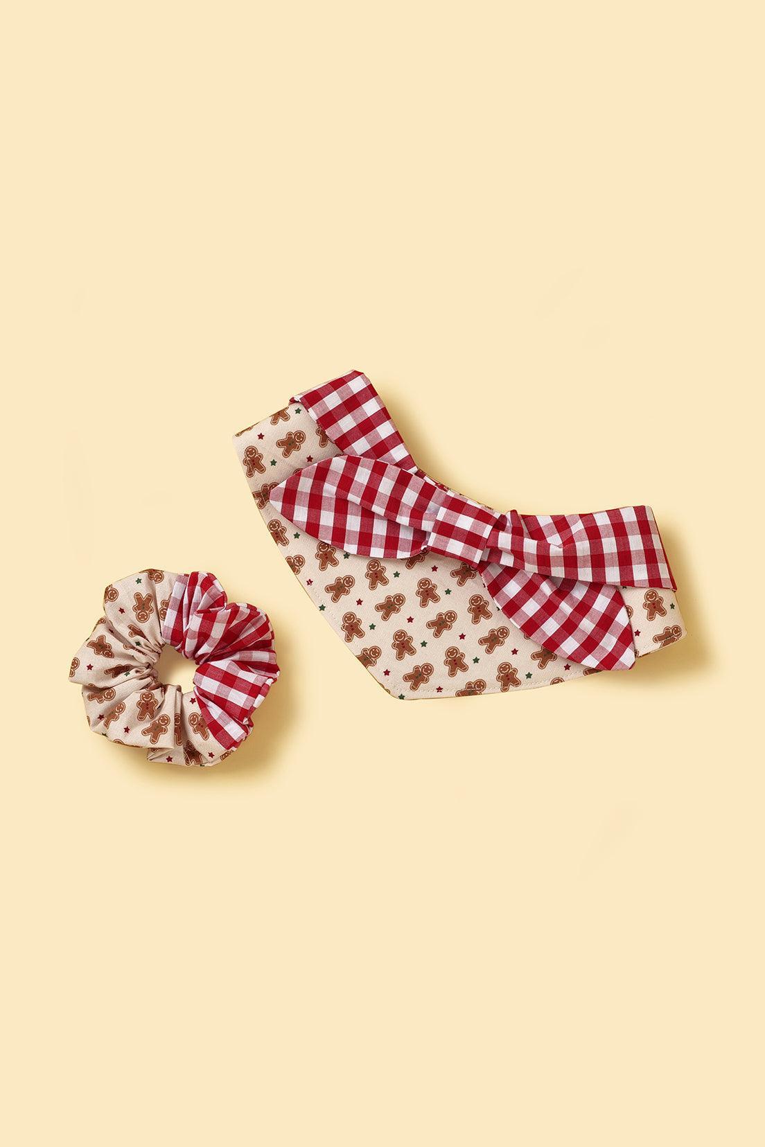 Handmade Christmas Morning Gingerbread Man gingham print bandana by BarkBarkBaby, featuring festive red and white checkered pattern.