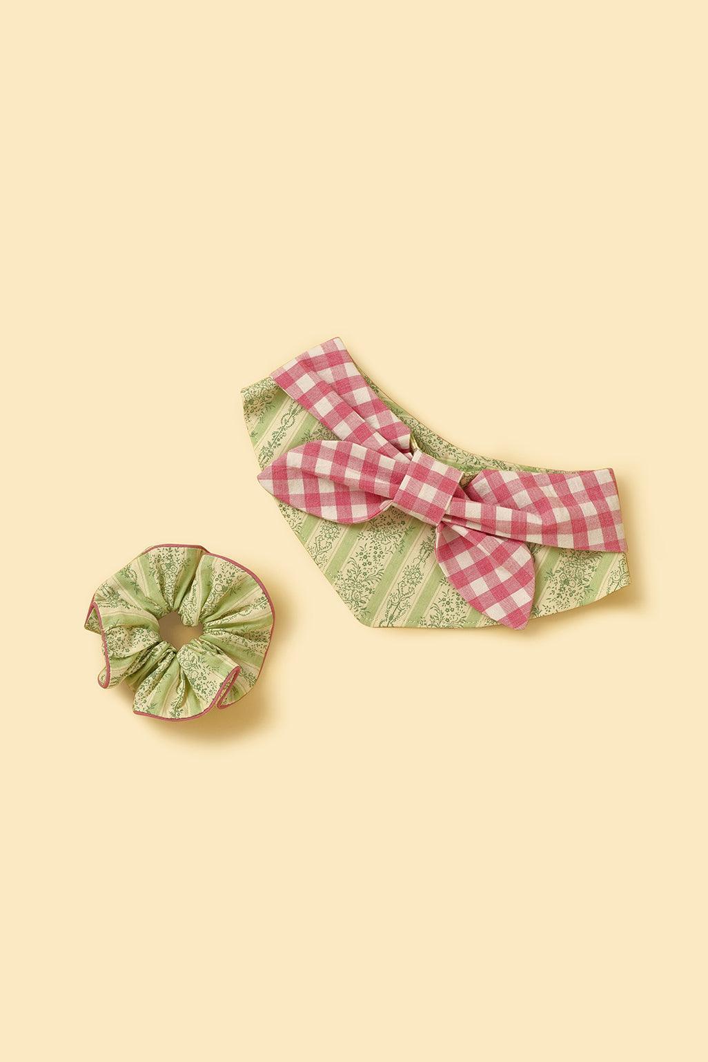 BarkBarkBaby Picnic Bliss floral gingham print bandana with colorful flowers on a classic red and white checkered pattern.