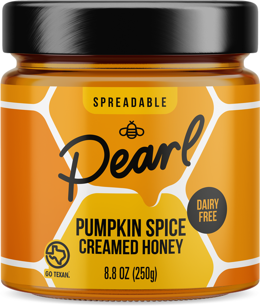 Creamed pumpkin spice honey by Pearl Honey Spreads, featuring a jar of smooth honey infused with pumpkin spice flavor.