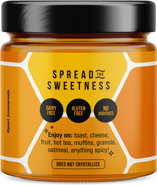 Creamed pumpkin spice honey jar from Pearl Honey Spreads with a label featuring autumnal design and honey inside.