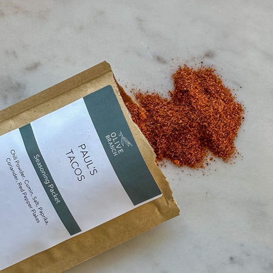 Olive Branch Oil & Spice Paul's Tacos seasoning blend packet with colorful label and spice mixture inside.