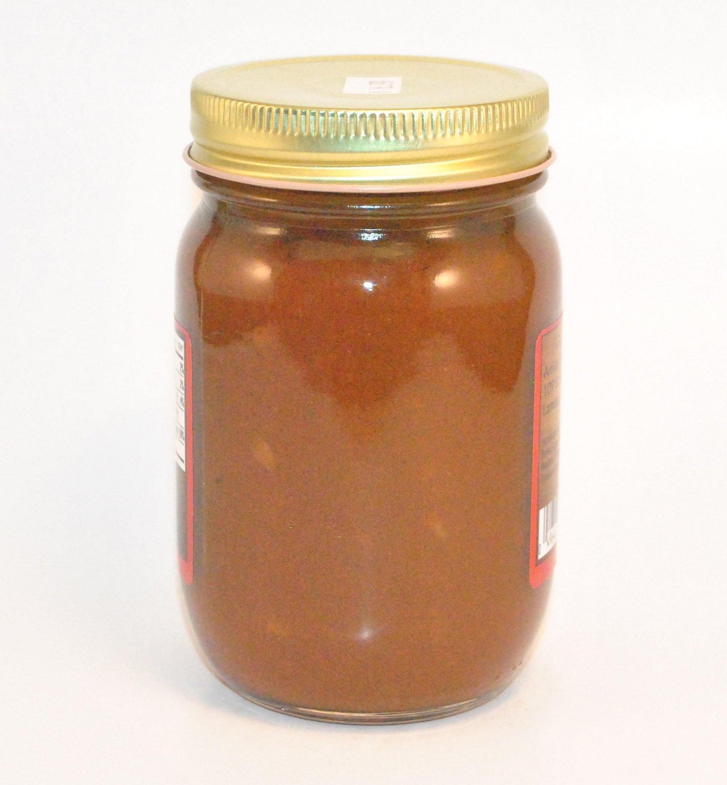 Canned Pecan Pumpkin Butter from Amish Country Store in a jar, showcasing a smooth, creamy pumpkin spread with pecan pieces visible.