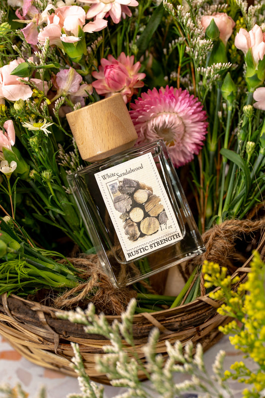Rustic Strength White Sandalwood perfume bottle, 1.7oz, with elegant packaging and a sleek design.