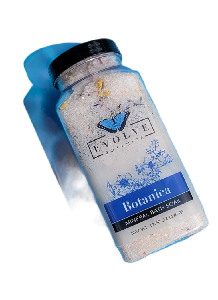Evolve Botanica Mineral Soak bath salt in a jar, featuring natural botanicals and relaxing mineral crystals for soothing bath experience.
