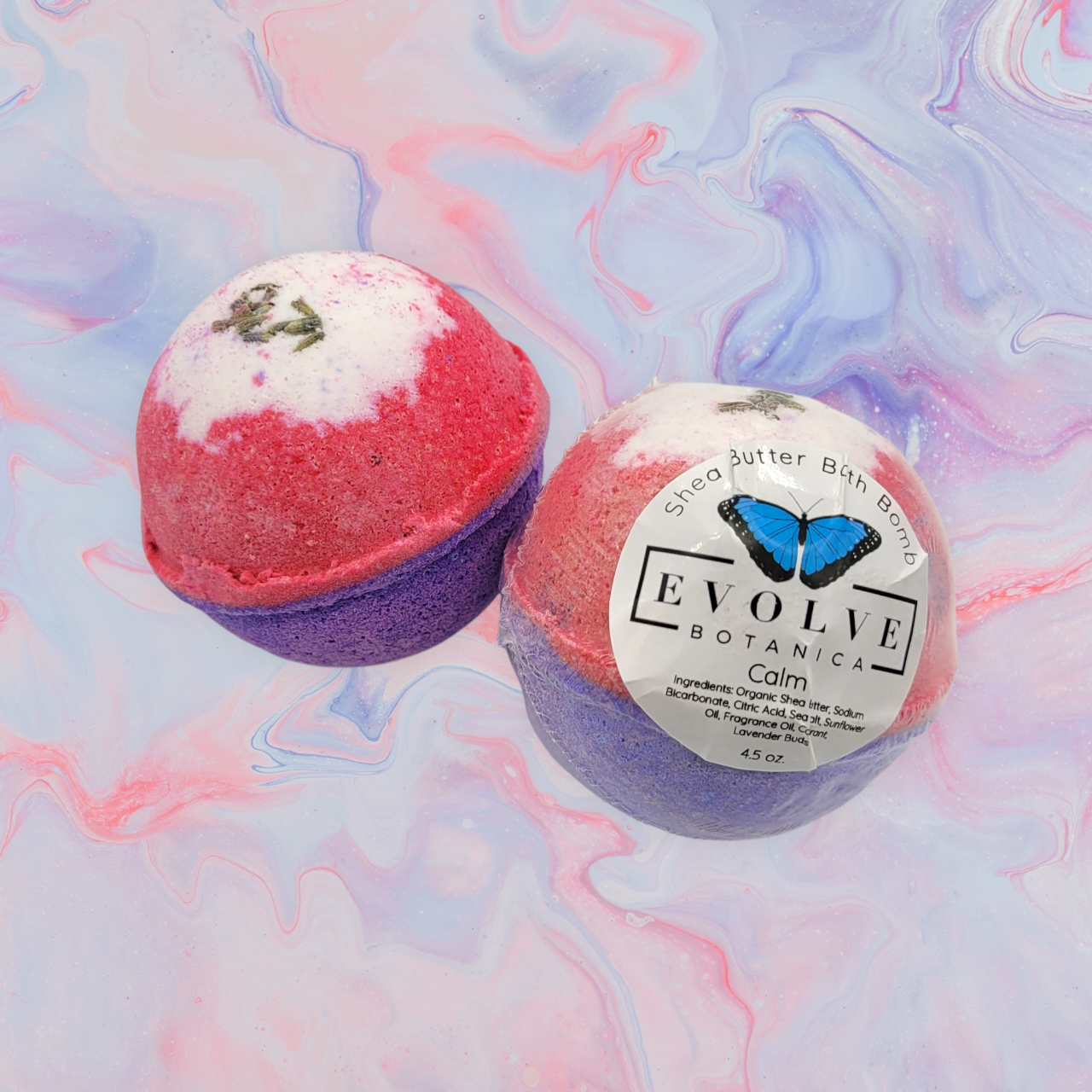 Evolve Botanica Just Calm Down bath bomb with calming lavender and essential oils, round shape and pastel purple color.