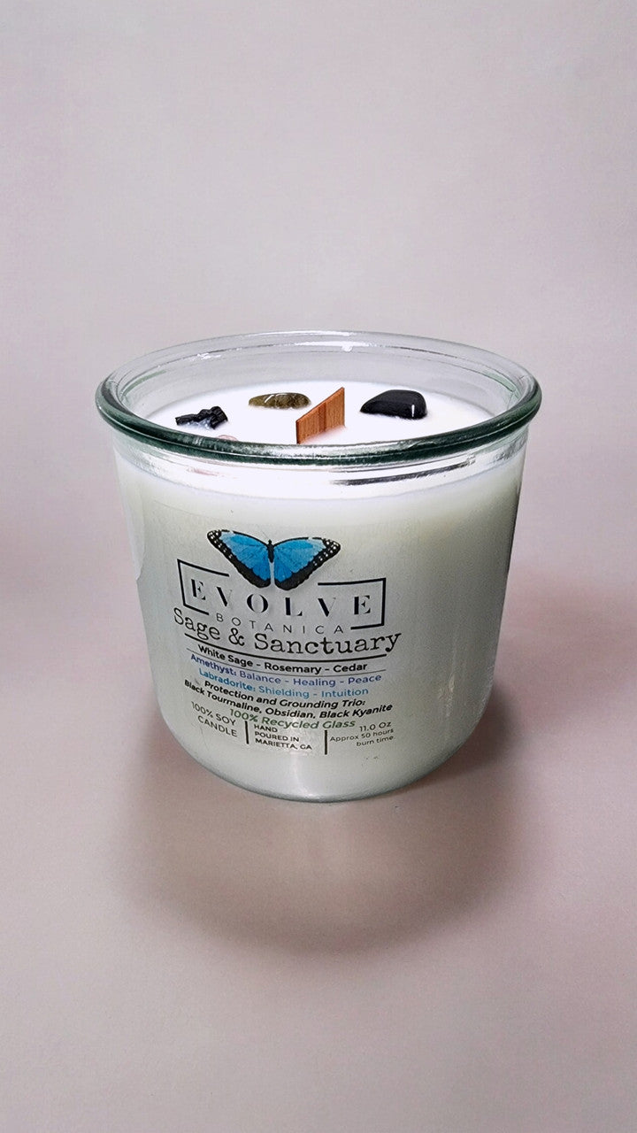 Rocks Candle by Evolve Botanica featuring sage, sanctuary stones like black kyanite, black tourmaline, obsidian, amethyst, and labradorite.