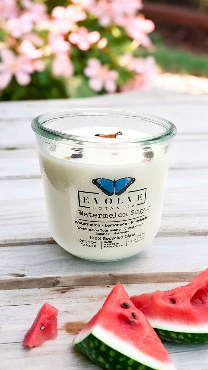 Evolve Botanica Watermelon Sugar Rocks Candle with gemstone accents, soy wax, and wood wick for a decorative and aromatic candle experience.