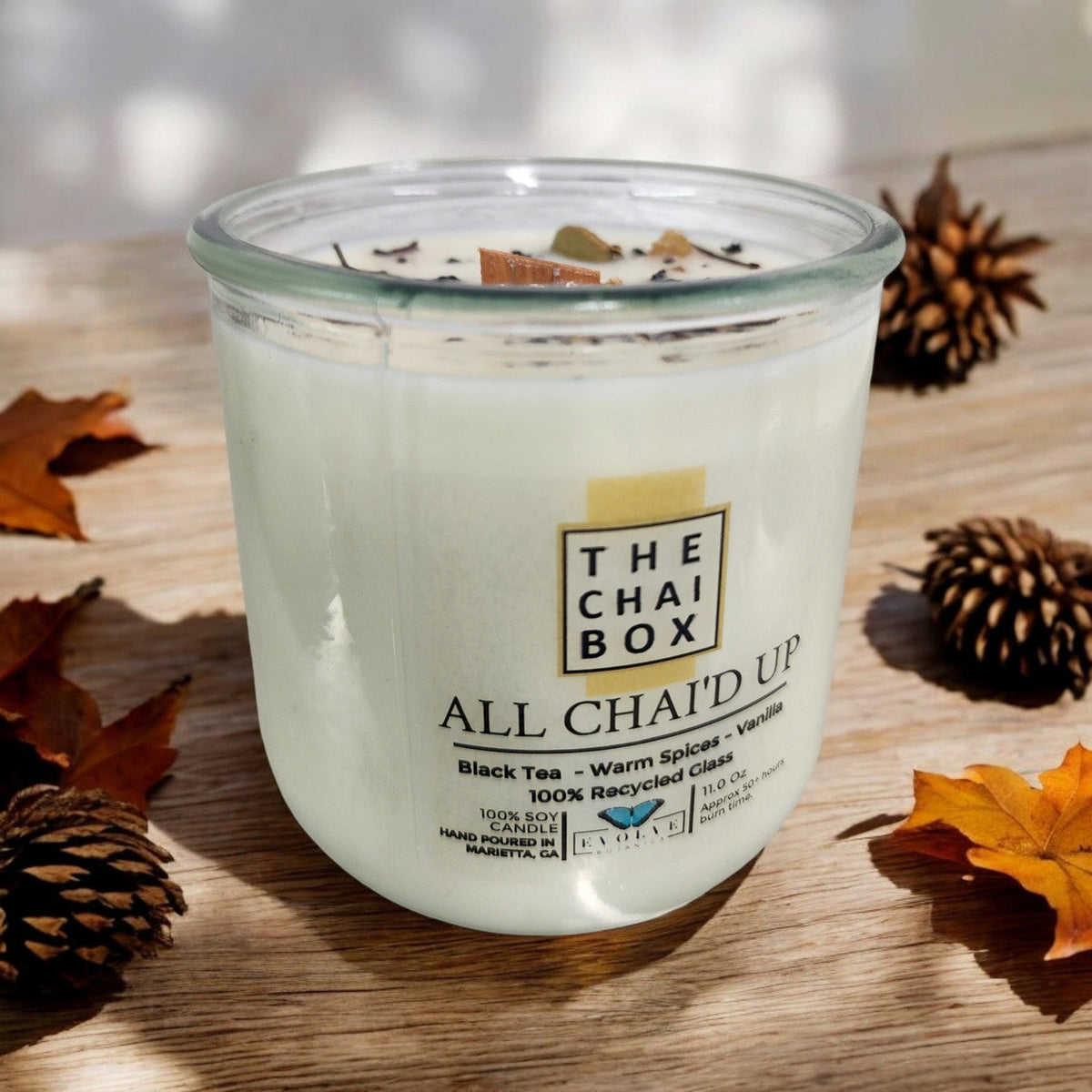 Evolve Botanica Rocks Candle Chai with wood wick and gemstone, soy wax in a decorative container, cozy and aromatic candle for home.