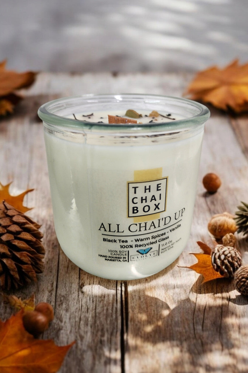Evolve Botanica Rocks Candle Chai with wood wick and gemstone, soy wax in a cozy, decorative candle holder.