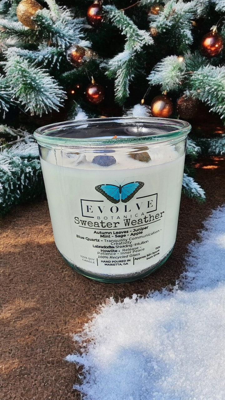 Evolve Botanica Rocks Candle Sweater Weather with wood wick, featuring howlite, labradorite, and sodalite stones in a soy candle.