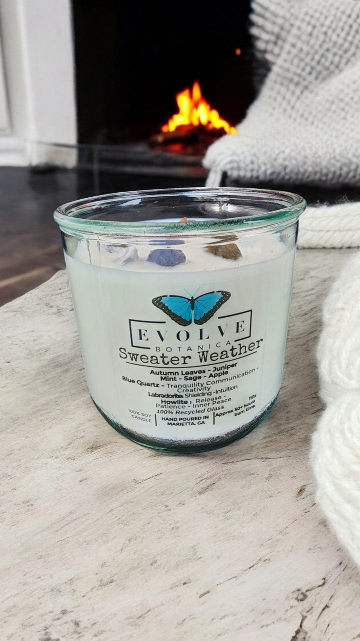 Evolve Botanica Rocks Candle Sweater Weather with wood wick, featuring howlite, labradorite, and sodalite gemstones in a soy candle.