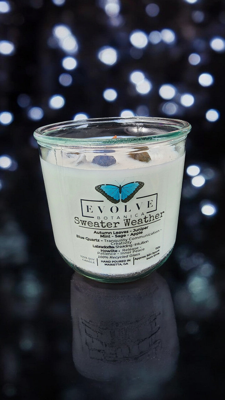 Evolve Botanica Rocks Candle Sweater Weather with wood wick, featuring howlite, labradorite, and sodalite gemstones in a soy candle.