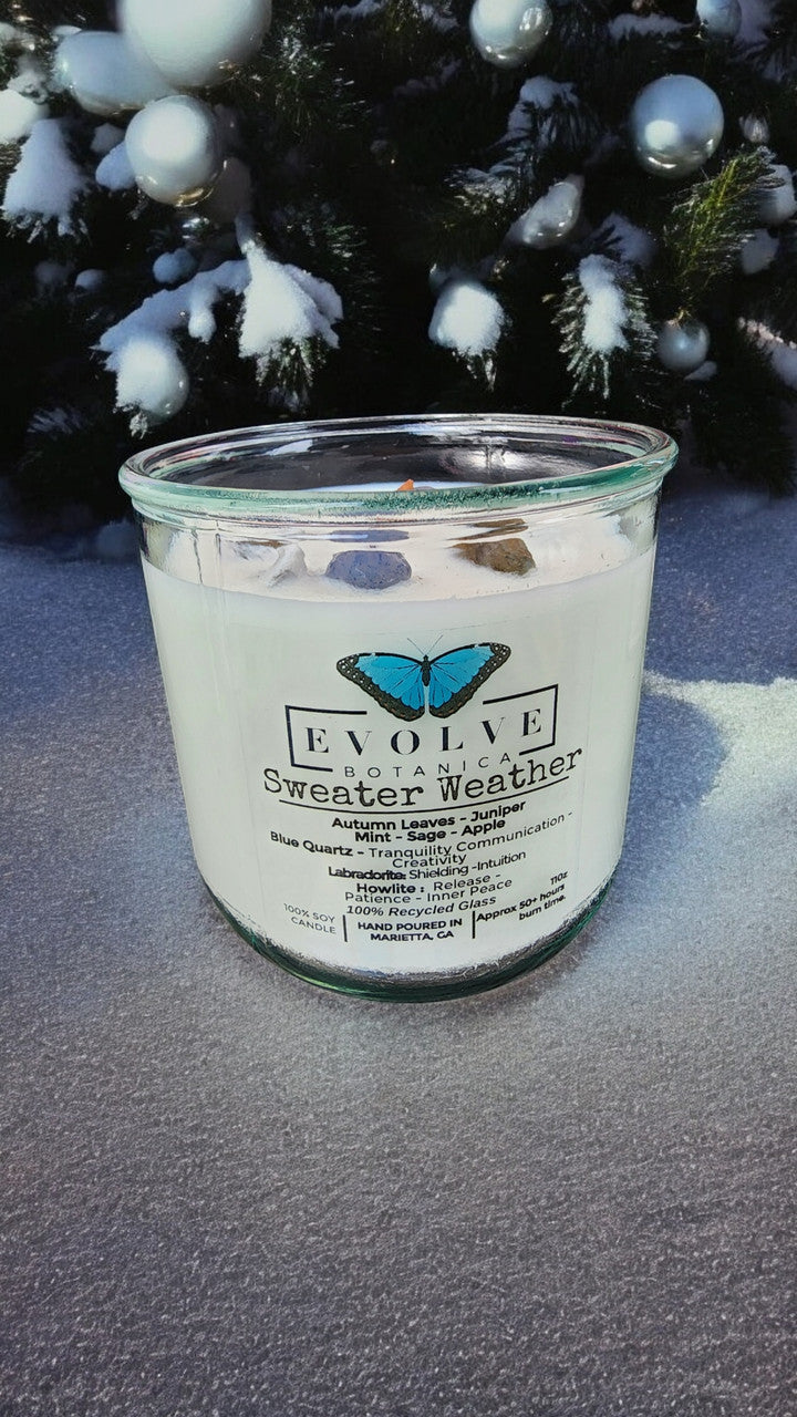 Evolve Botanica Rocks Candle Sweater Weather with wood wick, featuring howlite, labradorite, and sodalite gemstones for tranquility and intuition.