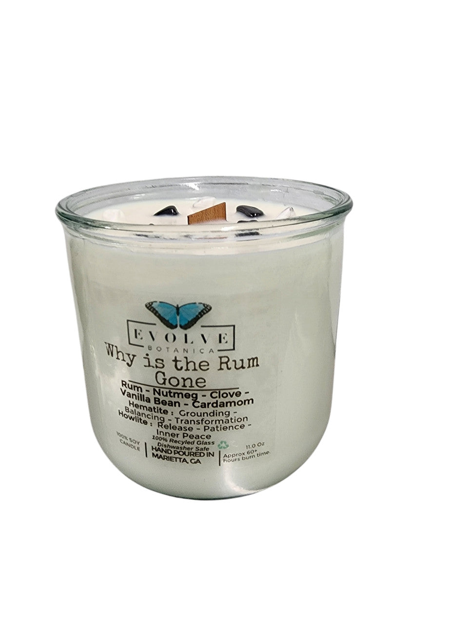 Evolve Botanica Rocks Candle "Why Is The Rum Gone?" with hematite and howlite stones, featuring a wood wick for grounding and relaxation.