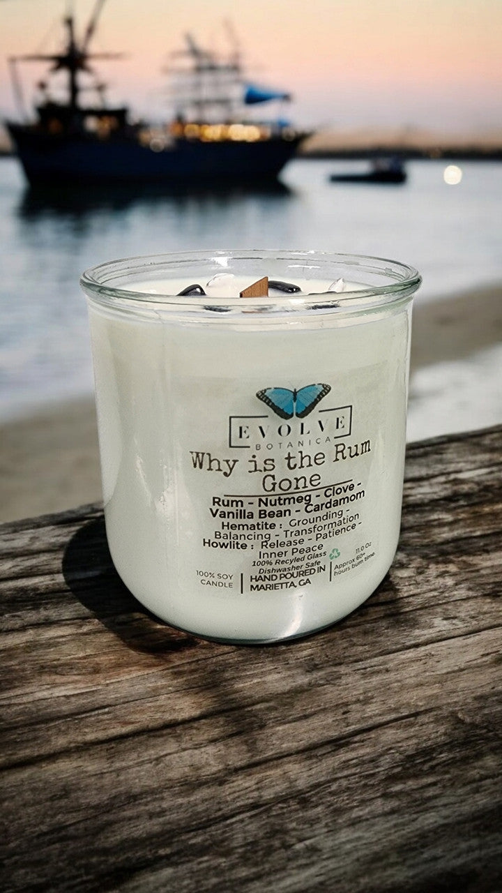 Evolve Botanica Rocks Candle "Why Is The Rum Gone?" with hematite and howlite stones, wooden wick, grounding and calming qualities