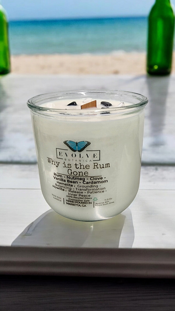 Rocks Candle by Evolve Botanica featuring hematite and howlite stones, with a wood wick for grounding, balancing, and inner peace.