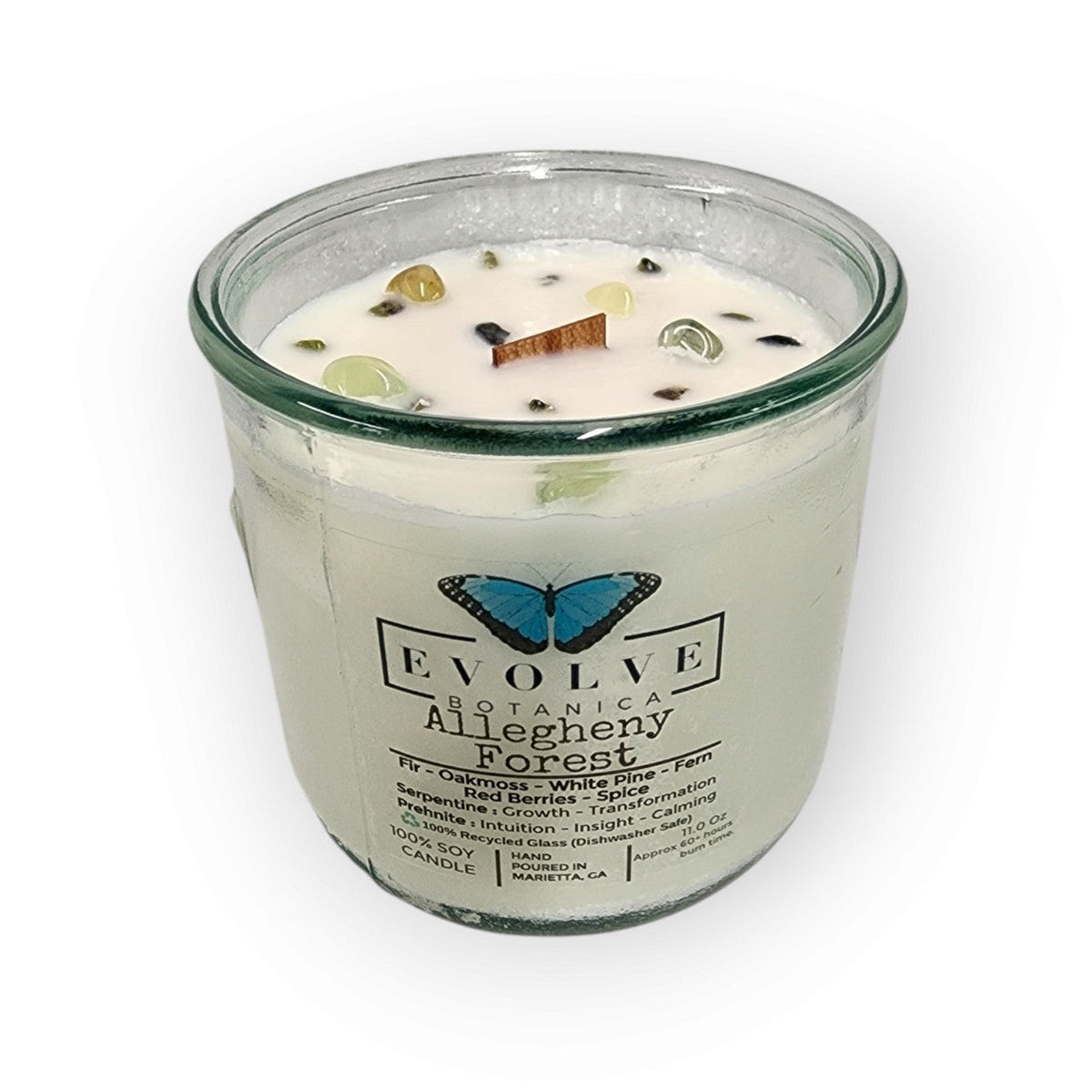Rocks Candle Falling Leaves by Evolve Botanica featuring a soy candle with peridot, red jasper, yellow aventurine gemstones and wood wick
