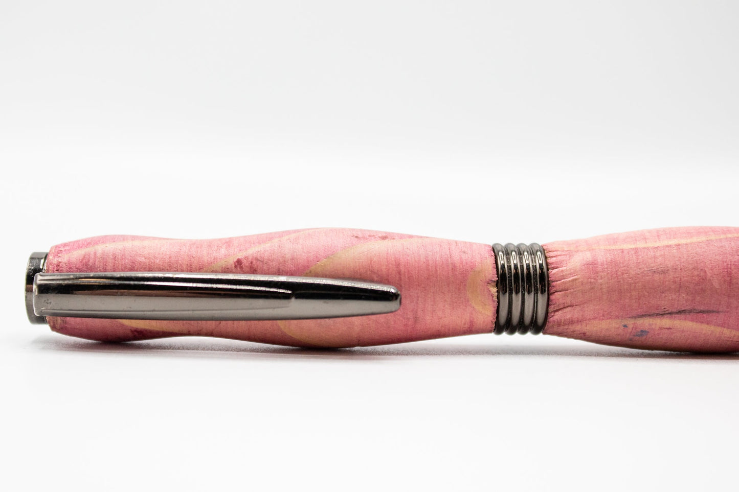 Pink stained handcrafted wood pen with a smooth finish, perfect for home and garden use, made by BuyNebraska.com.