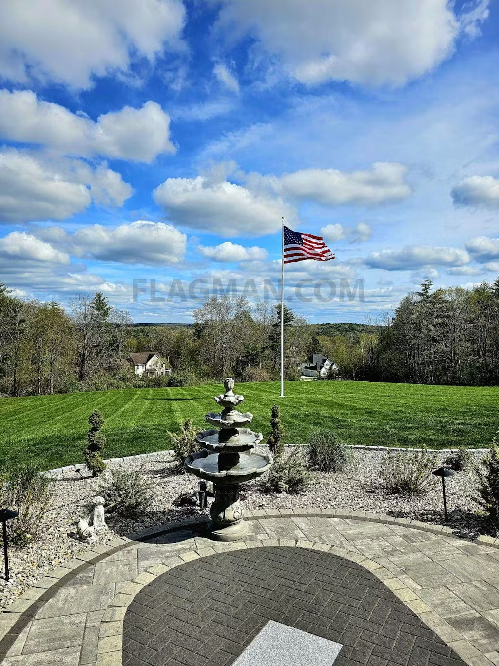American flag made of Guardian™ polyester on a pole, showcasing vibrant stars and stripes, made in the USA by Flagman of America.