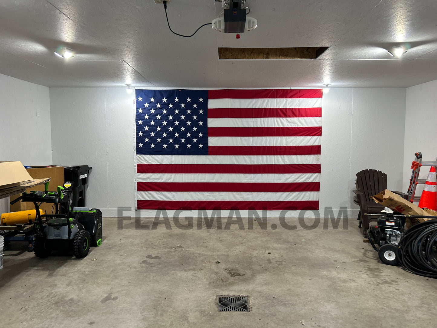 WallSafe™ polyester American flag with reinforced edge grommets, wall-mounted, made in USA, features vibrant stars and stripes.