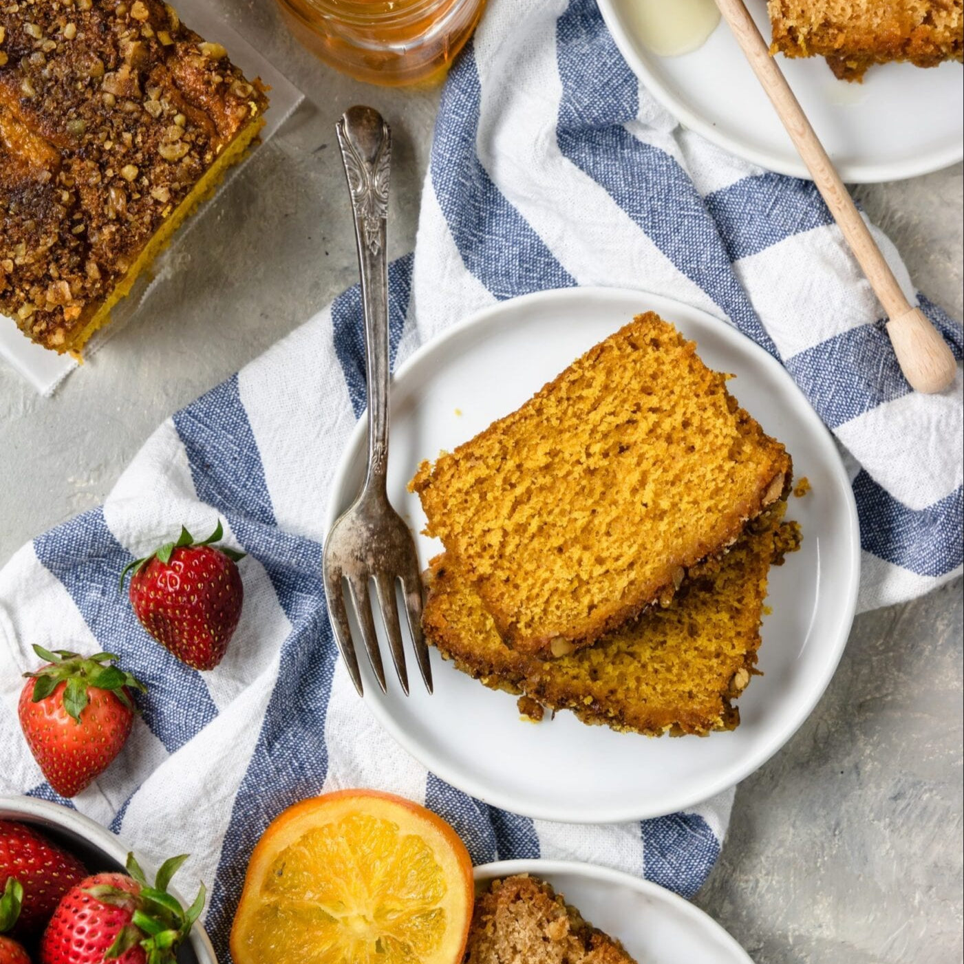 Slice of pumpkin streusel coffee cake from Beatrice Bakery showing golden cake with cinnamon streusel topping.