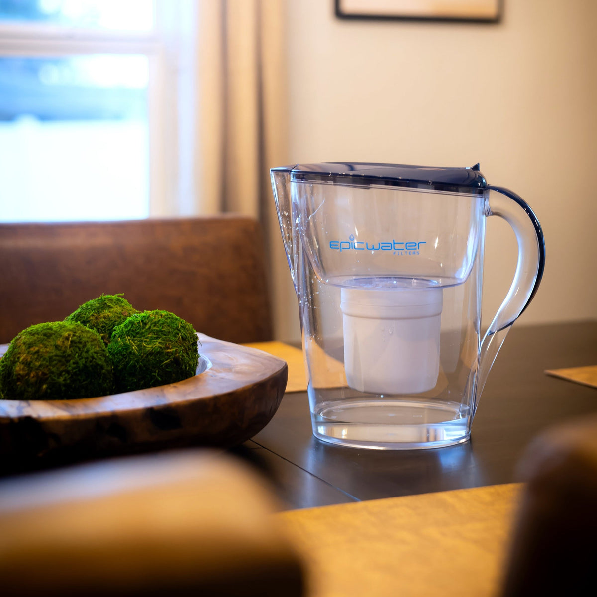 Blue-lid Pure XP water pitcher by Epic Water Filters USA, designed to reduce fluoride, PFAS, and parasites from drinking water.