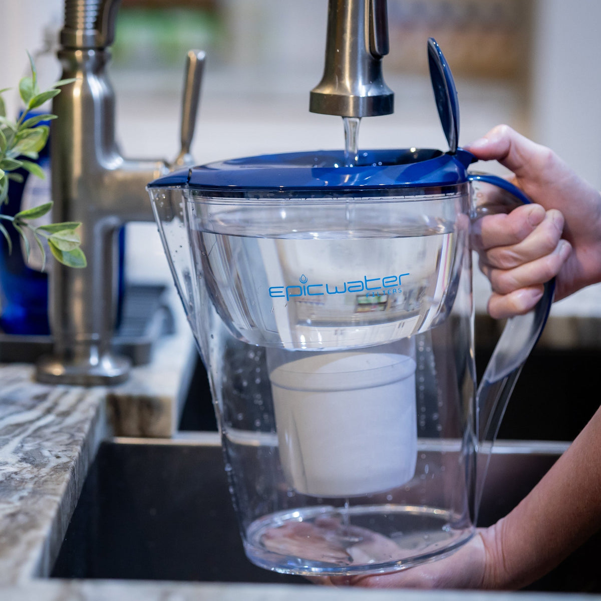Blue-lid Pure XP water pitcher by Epic Water Filters USA, designed to reduce fluoride, PFAS, and parasites in drinking water.