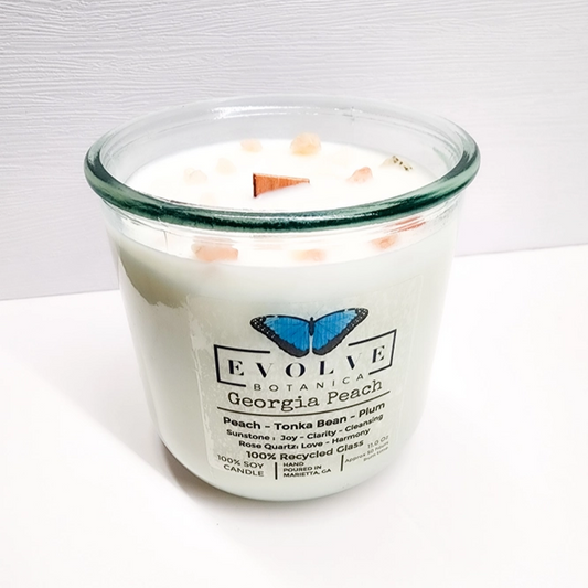 Evolve Botanica Rocks Candle in Georgia Peach with wood wick, gemstone soy candle in a tumbler jar.