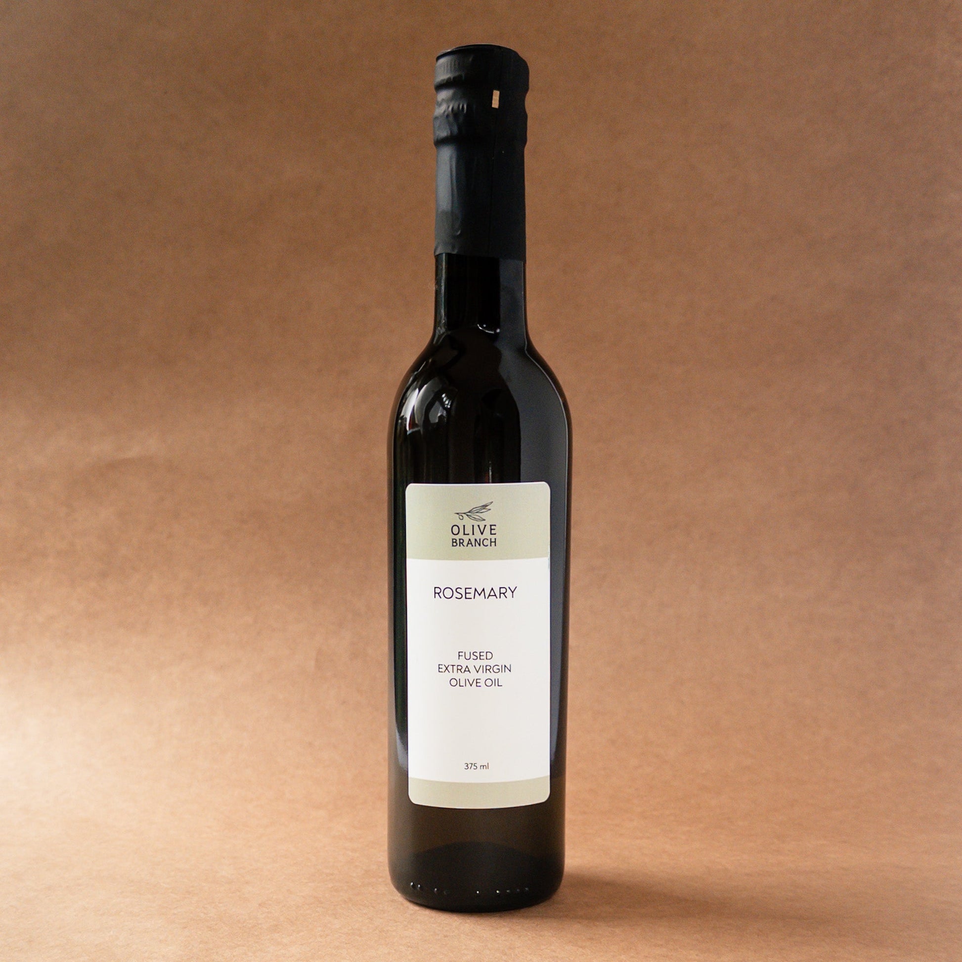 Bottle of Olive Branch Oil & Spice Rosemary Fused Extra Virgin Olive Oil, featuring fresh rosemary herbs infused in green olive oil.