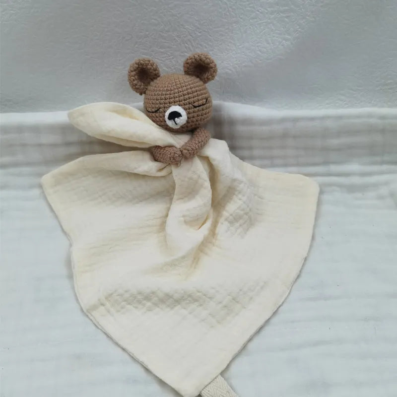 Baby bib with sleeping animals and rattle, featuring soft fabric and playful animal designs by Petite Pioneers.