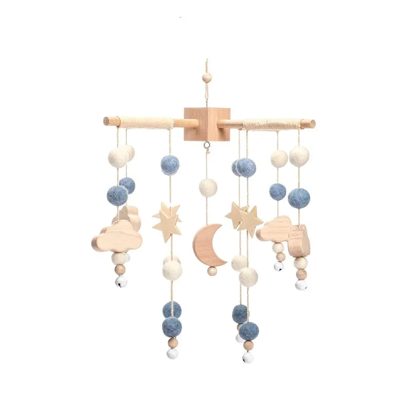 Wooden mobile hanging toys by Petite Pioneers featuring colorful, handcrafted wooden shapes for nursery decor and baby entertainment.