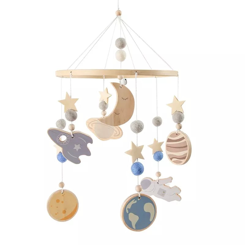 Wooden mobile hanging toys by Petite Pioneers, featuring colorful crafted wooden animal and star shapes for nursery decor.