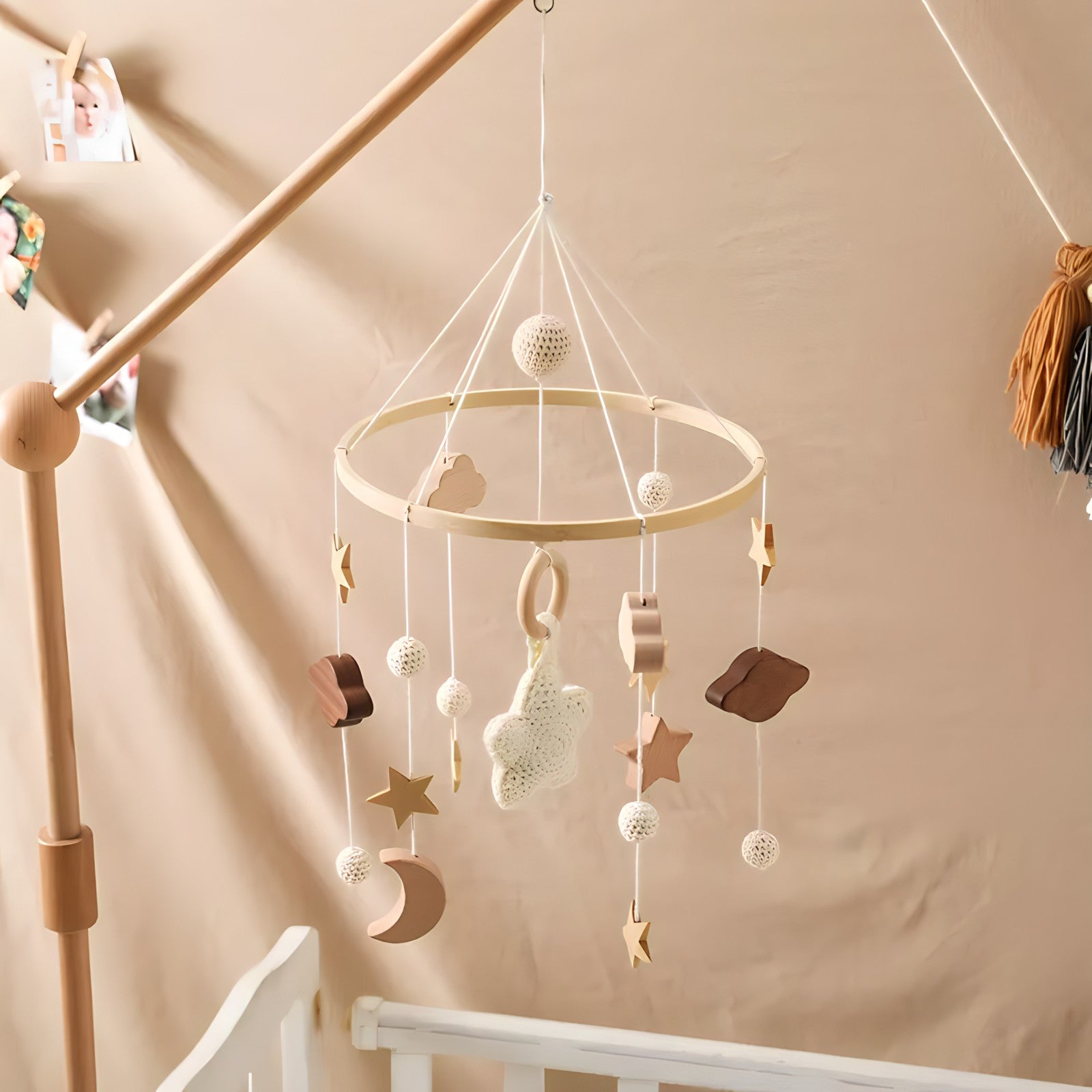 Colorful wooden mobile hanging toys by Petite Pioneers featuring natural wood, playful designs, and soft pastel accents for nursery decor