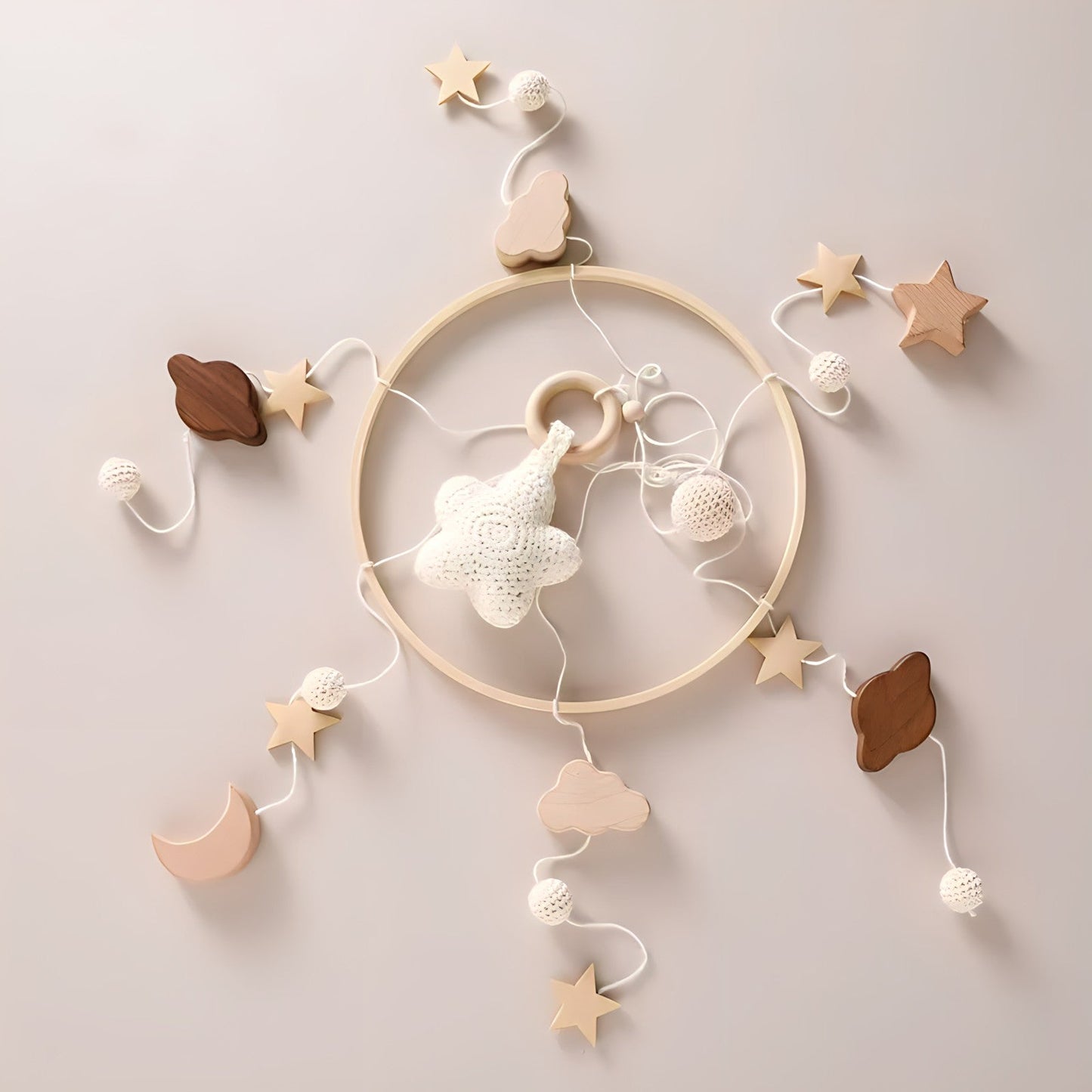 Wooden hanging mobile toys by Petite Pioneers featuring colorful, handcrafted wooden figures for nursery decoration.