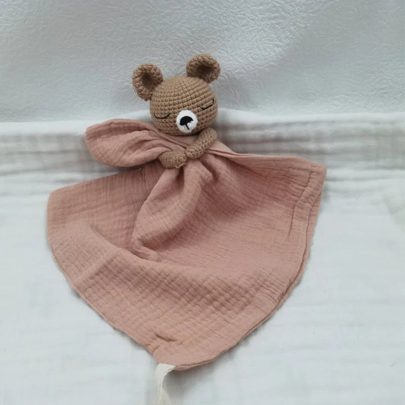Baby bib with sleeping animals and rattle from Petite Pioneers, featuring soft fabric and playful animal designs.